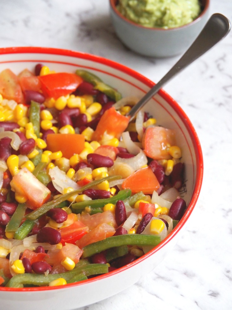 mexican corn and bean stew with spoon