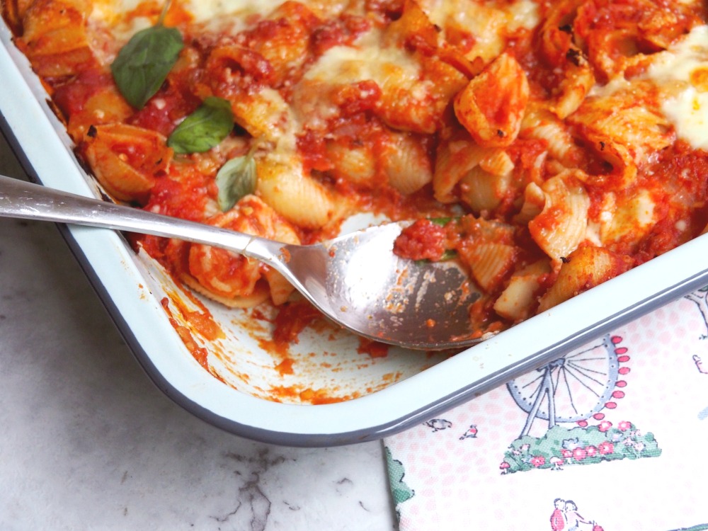 tomato mozzarella bake serving spoon