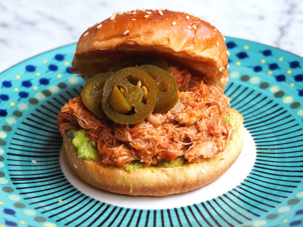 slow cooker pulled chicken served in a bun