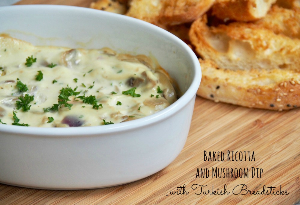 baked ricotta and mushroom dip with turkish breadsticks on side