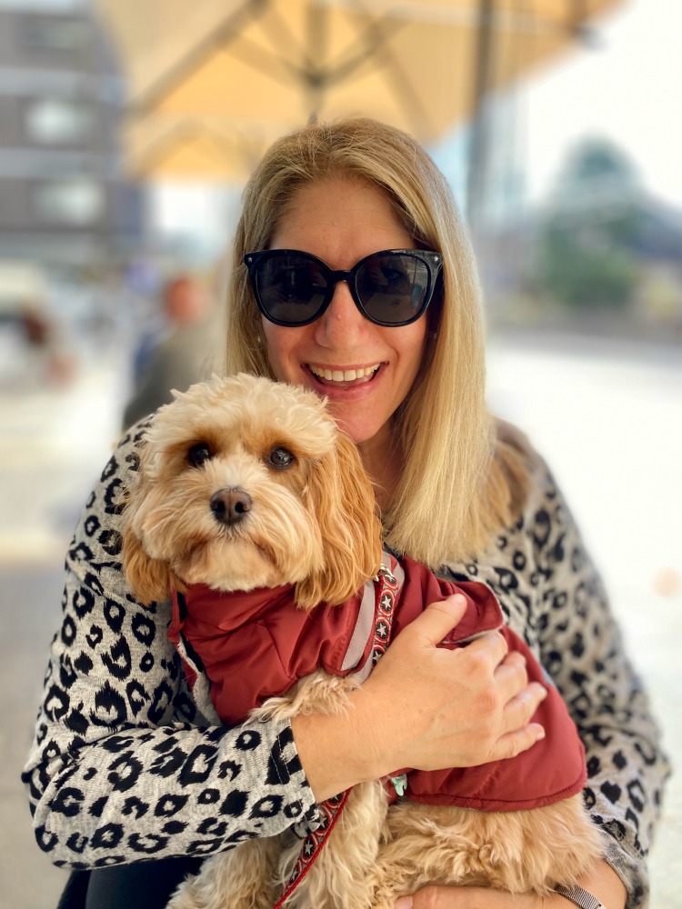 woman holding cavoodle