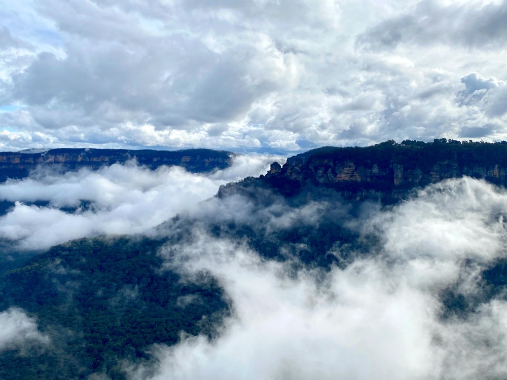 blue mountains under cloud cover