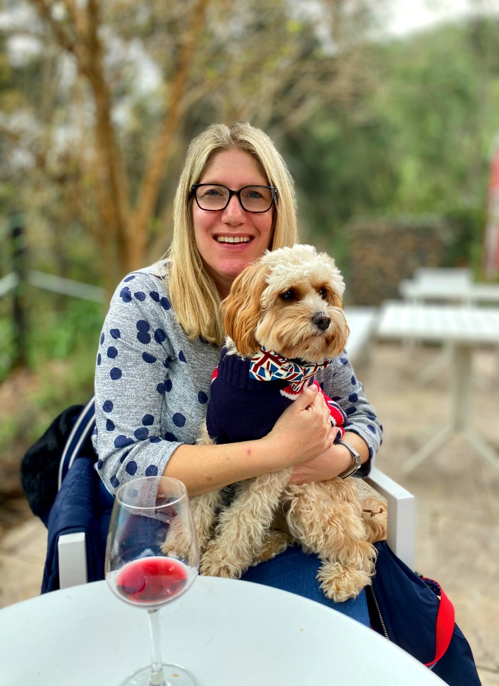 woman wine tasting holding dog greenway wines broke