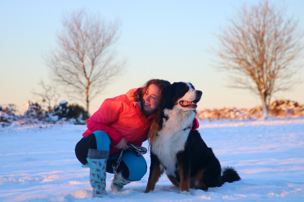 Lisa Dickenson in the snow with her dog