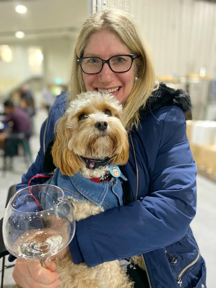 woman and dog wine tasting at Piggs Peake