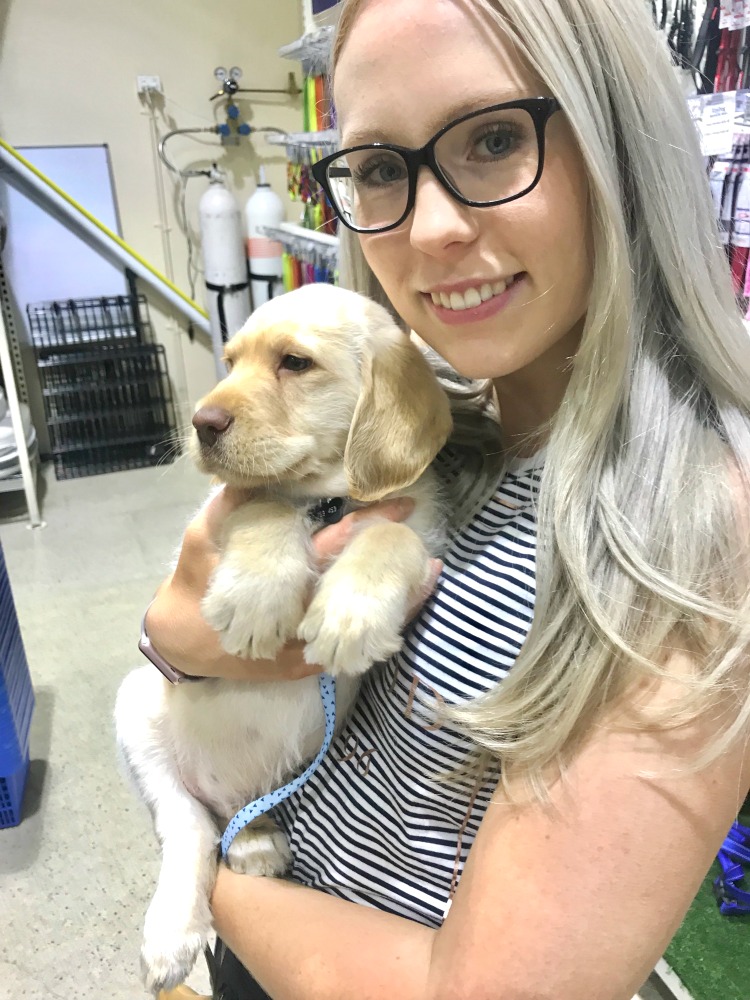 woman holding a dog