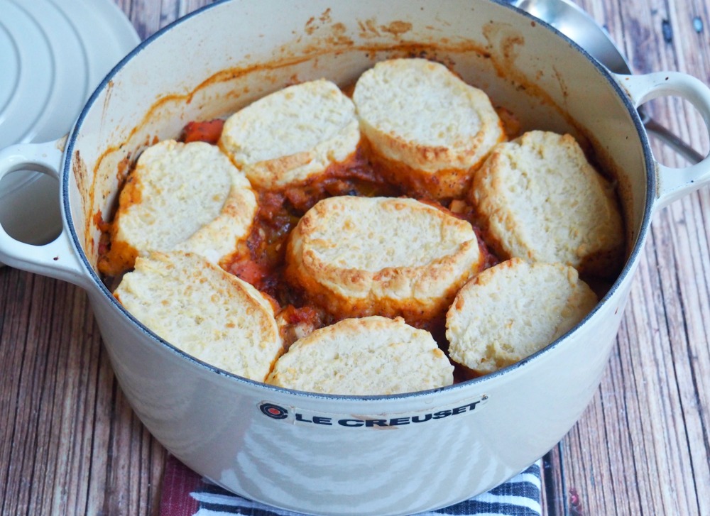 harissa vegetable stew with cheddar dumplings in pot