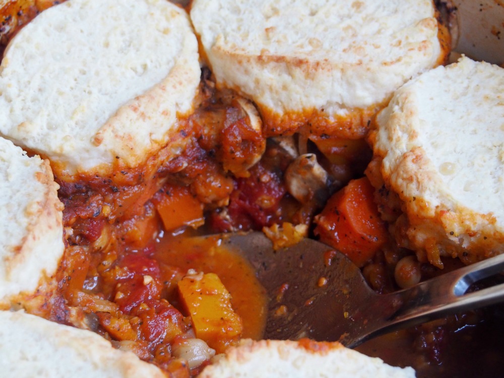 pot of harissa vegetable stew with spoon 