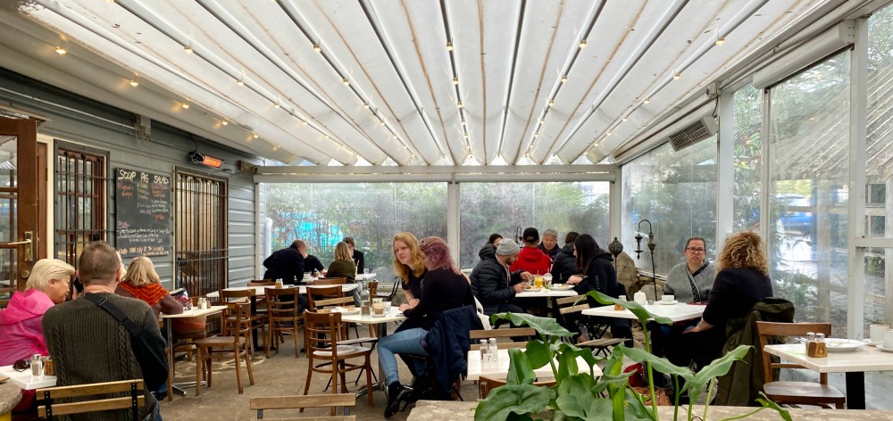 people sitting in a cafe courtyard