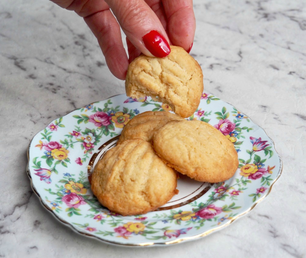 picking up a lime coconut and cream cheese cookie