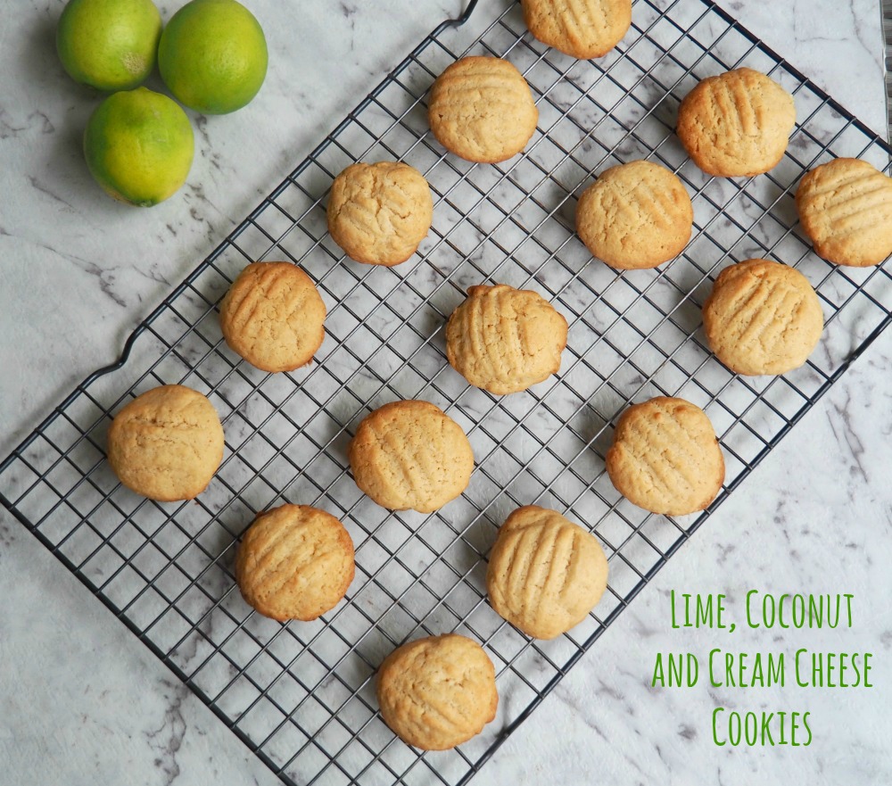 lime coconut cream cheese cookies with limes in background