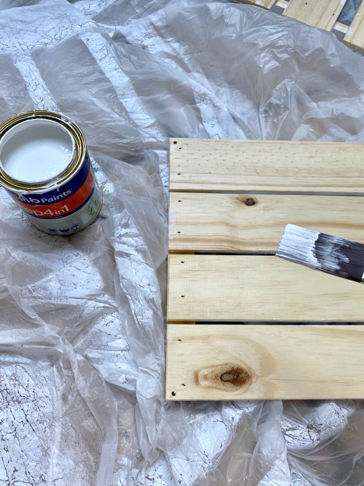 wooden box paintbrush and primer