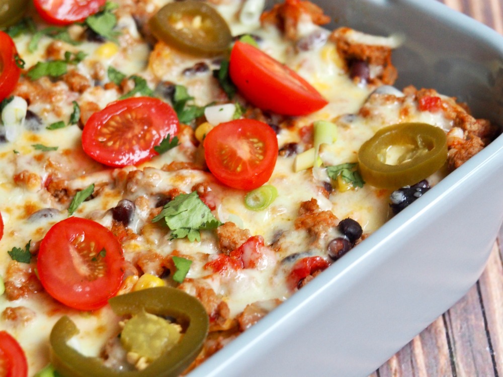 loaded turkey nachos topped with cheese tomato and jalapenos