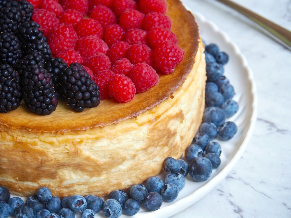 looking down on crustless cheesecake topped with berries