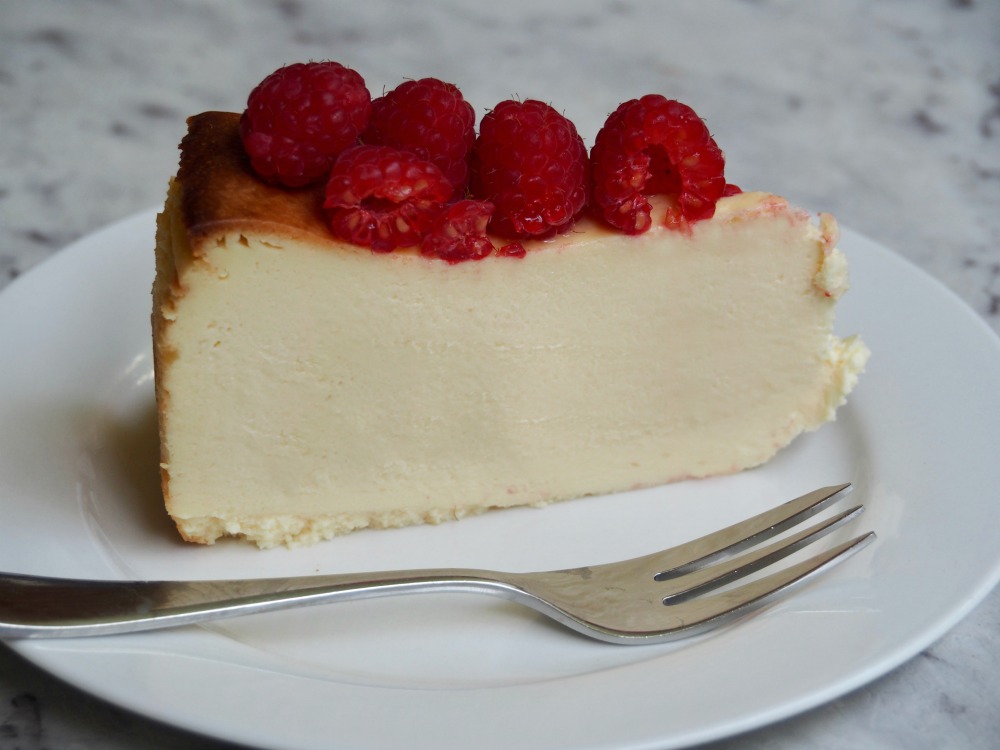 slice of crustless cheesecake topped with raspberries