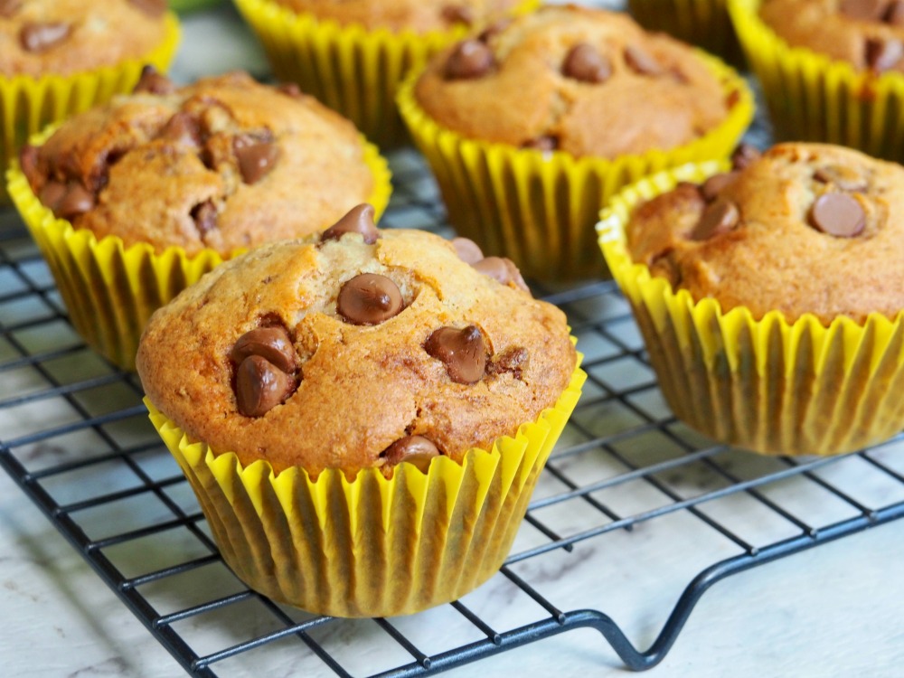 close up of pear and choc chip muffins on cooling rack