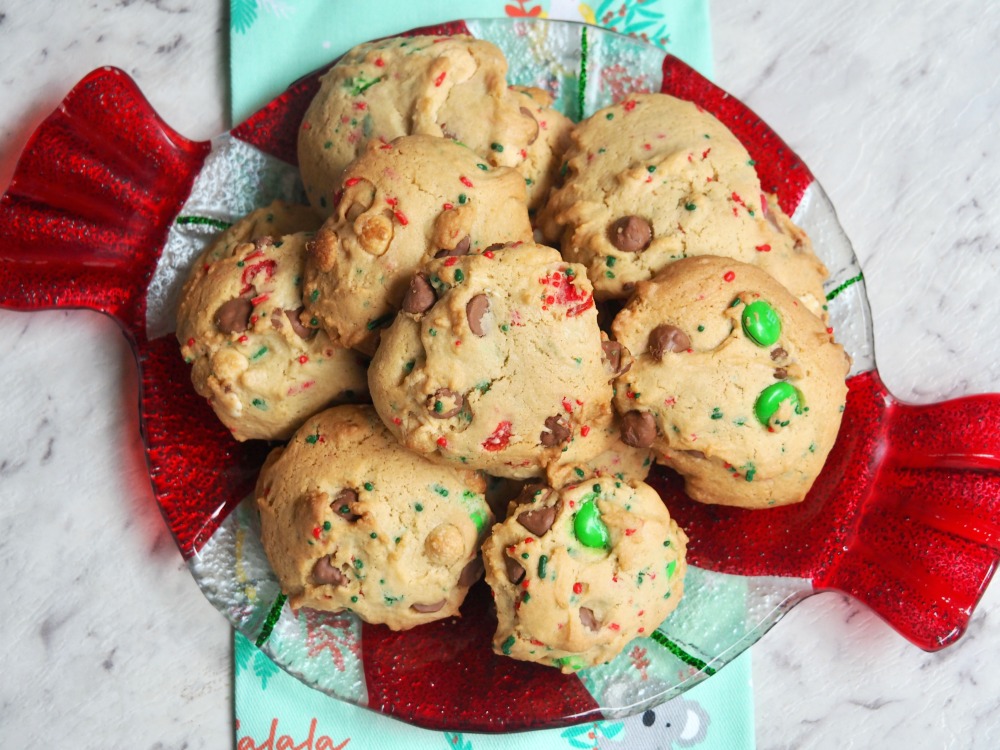 looking down on a plate of fully loaded choc chip and m and m christmas cookies