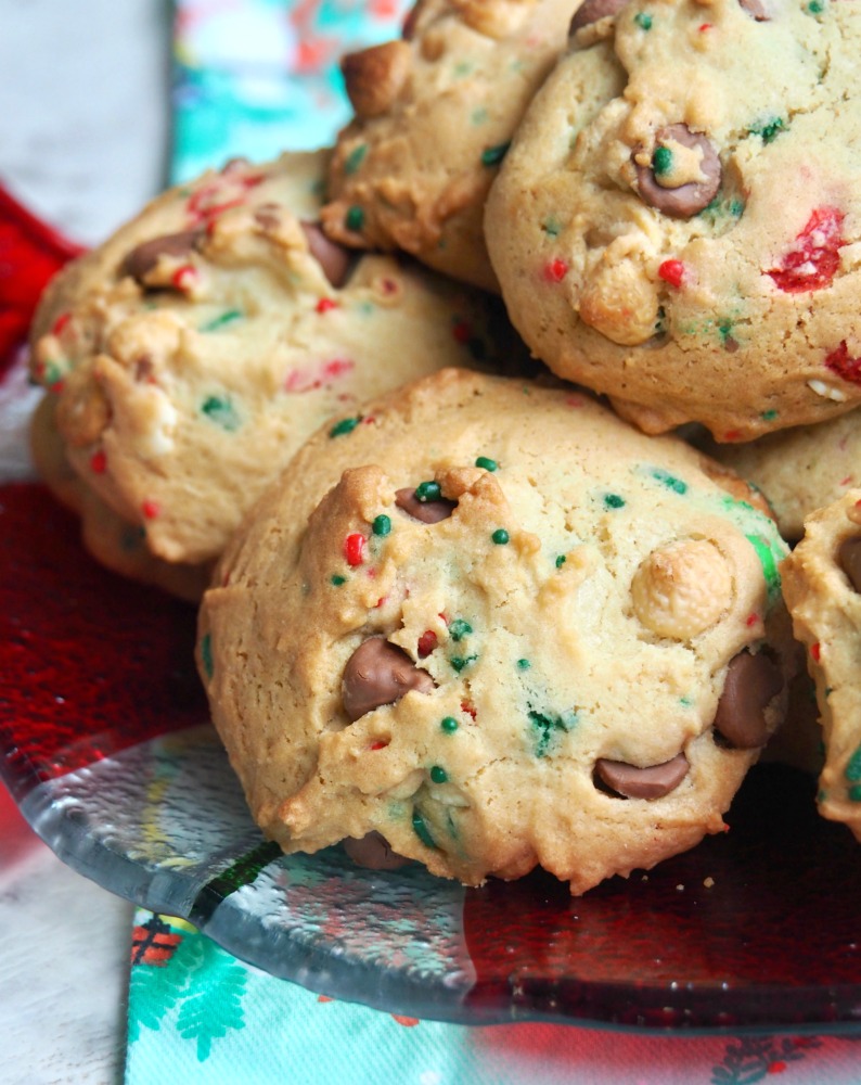 plate of fully loaded christmas choc chip and m and m cookies