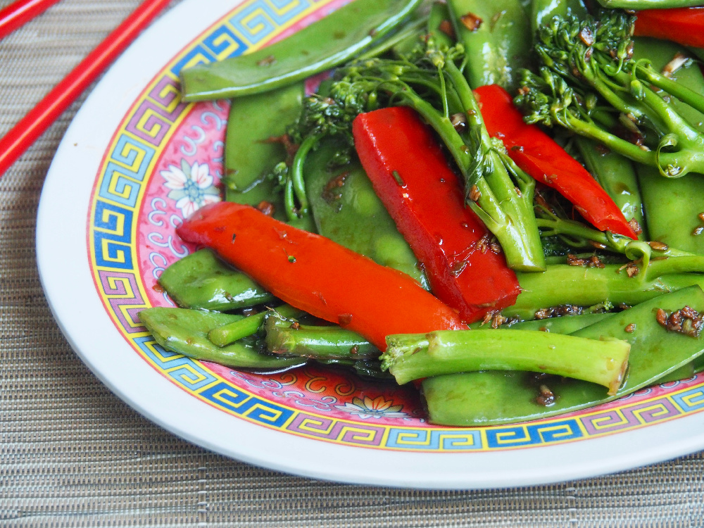 steamed asian veggies with chopsticks