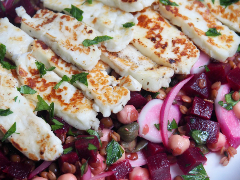 halloumi on top of chickpea lentil and beetroot salad