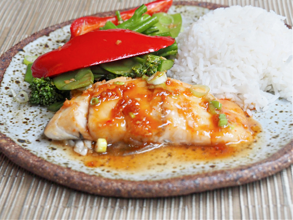 soy and sweet chilli fish with steamed rice and Asian greens