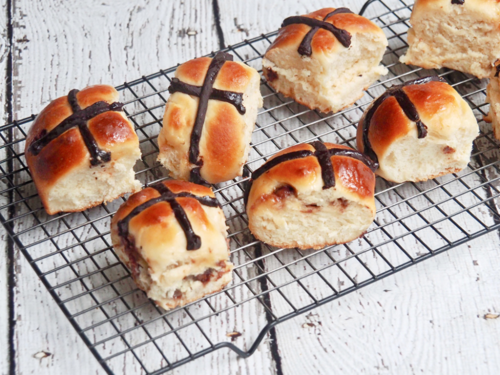 choc chip hot cross buns on cooling rack