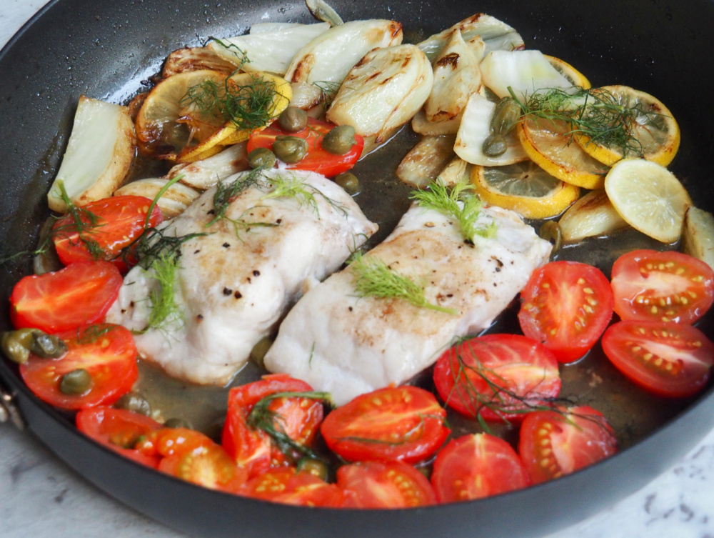 lemon fish with fennel and capers in pan