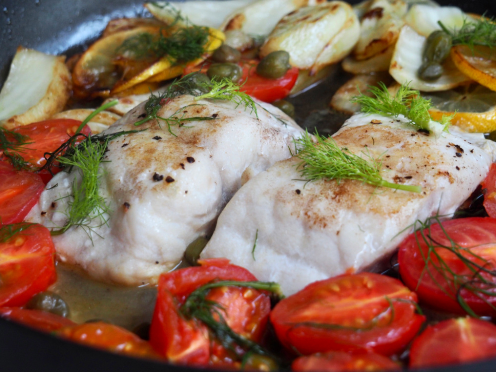 lemon fish with fennel and capers close up