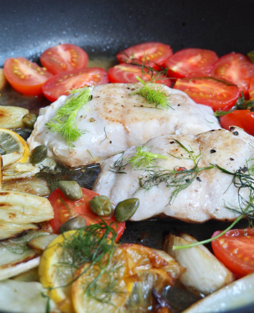 lemon fish with fennel and capers in pan