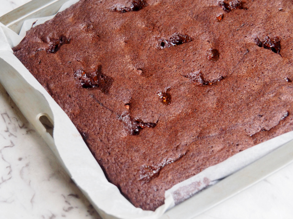 jam puddle brownies before cutting in tin