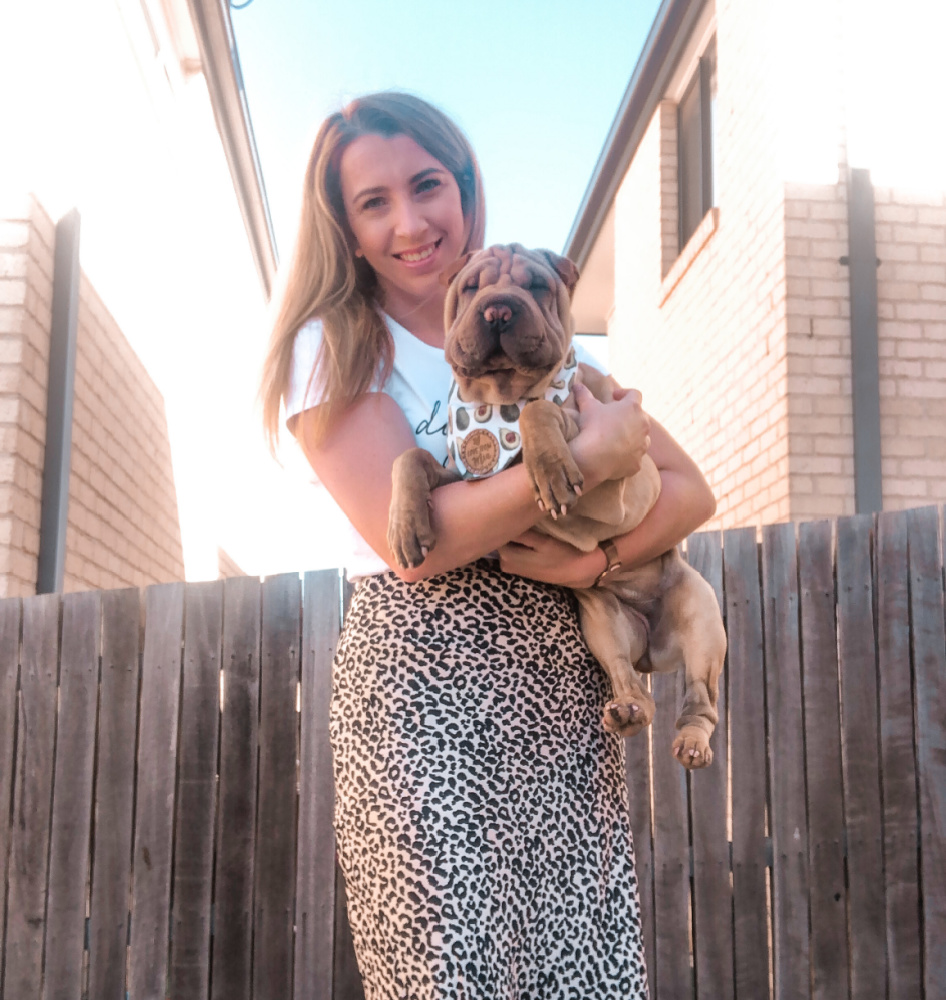 woman holding sharpei