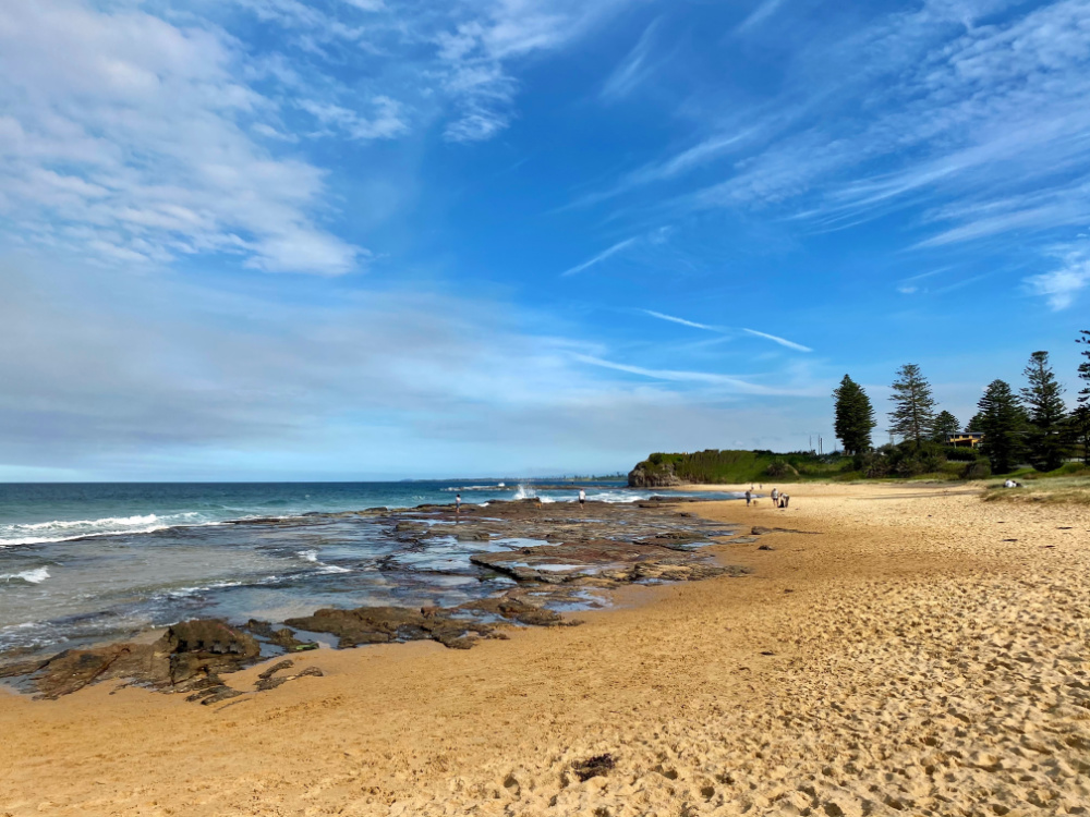 looking across beach to rockpools