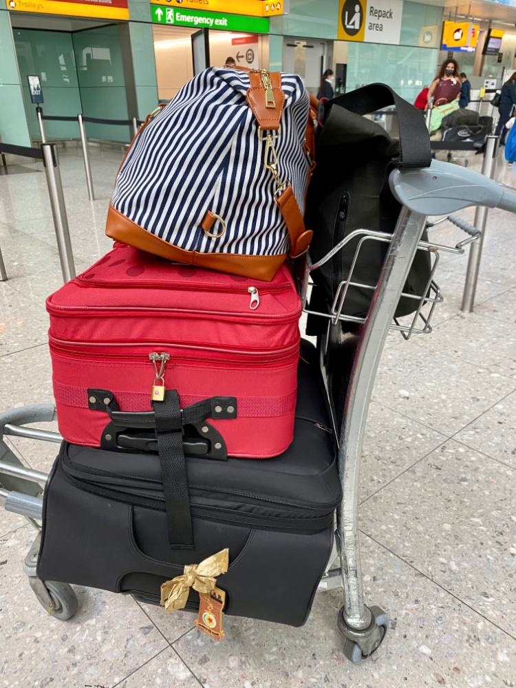 luggage trolley full of bags