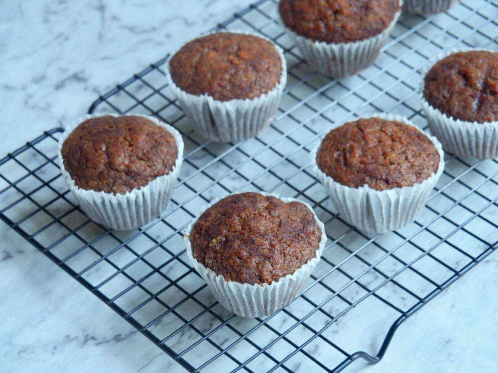 uniced carrot cake cupcakes on cooling rack