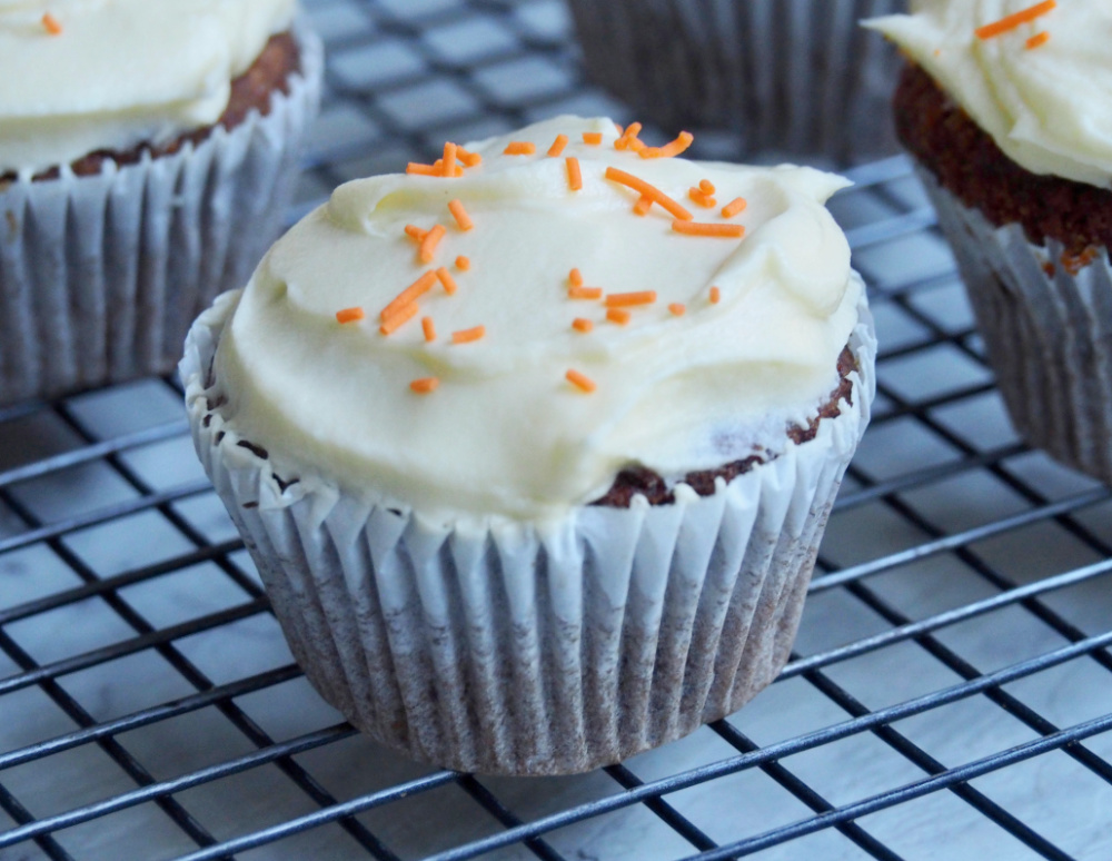 carrot cupcake on wire rack close up