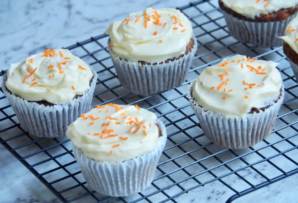 carrot cake cupcakes on a wire rack