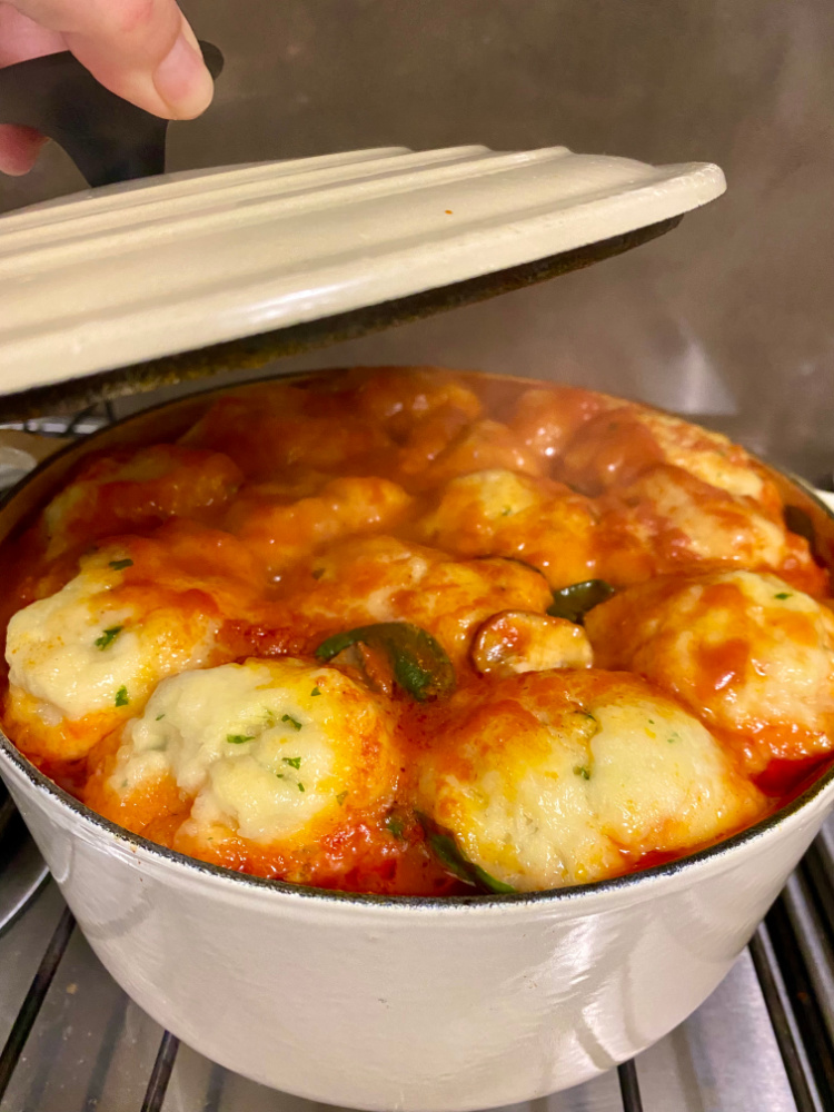 taking lid off pot of chicken and paprika stew