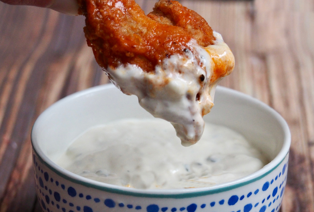 oven baked chicken wings dipped in blue cheese sauce