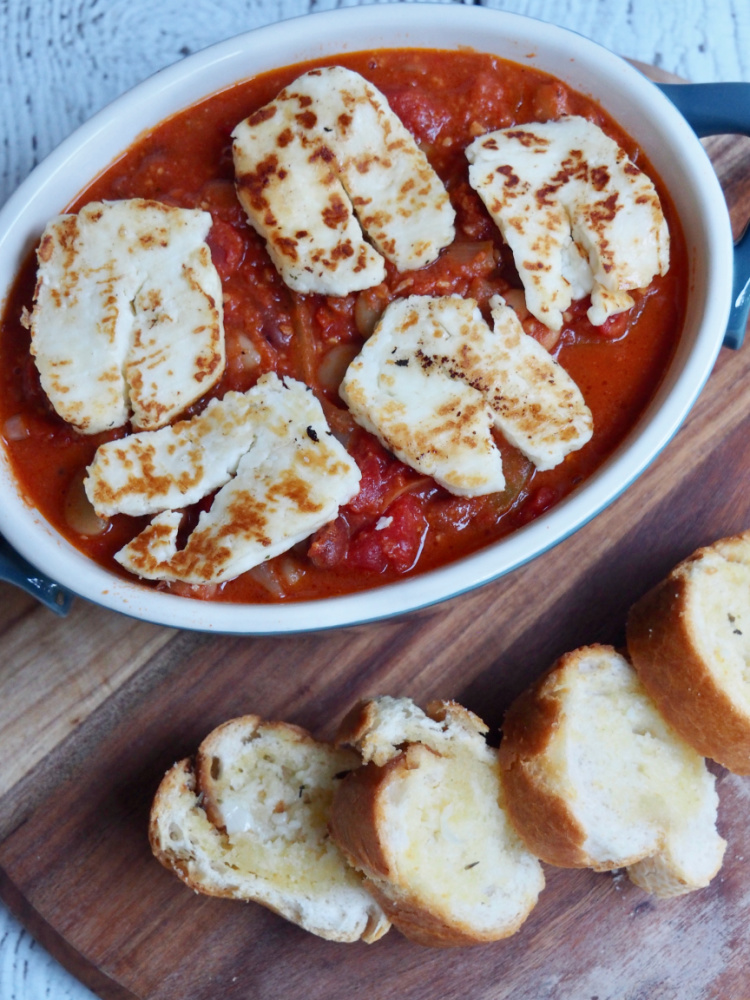 looking down on a pot of halloumi and bean stew