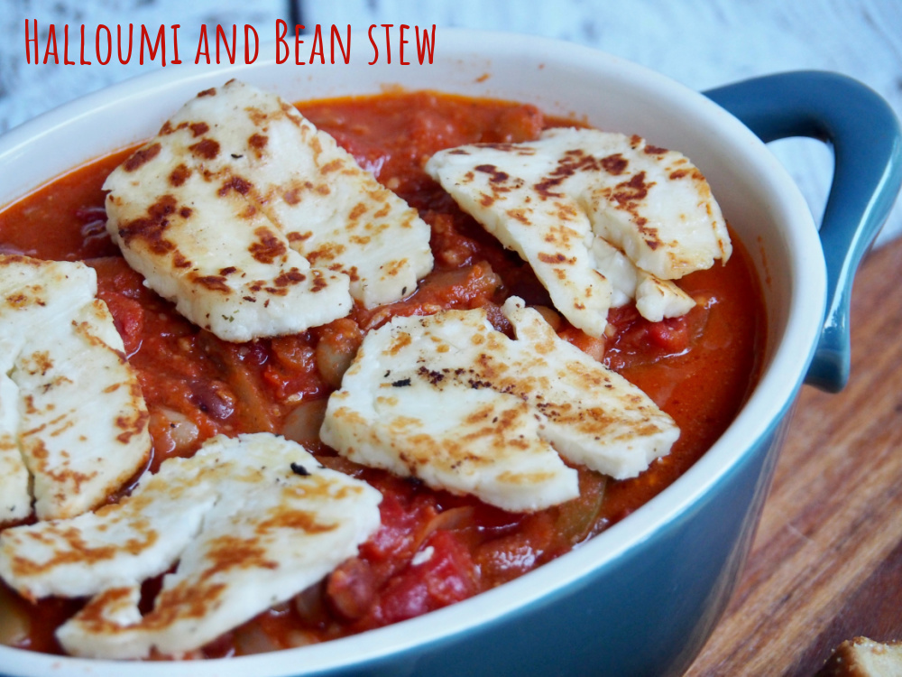 side view of bean stew with slice of halloumi on top