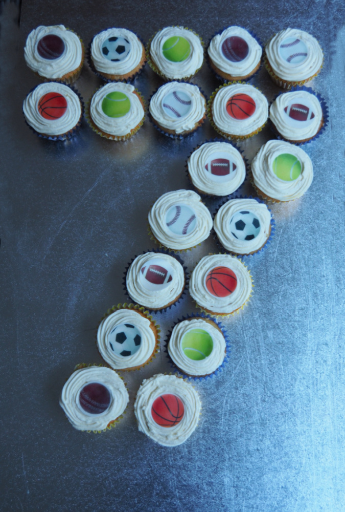 number 7 birthday cake made out of cupcakes