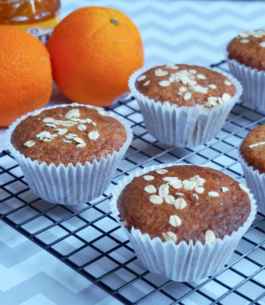 marmalade muffins with oranges in background