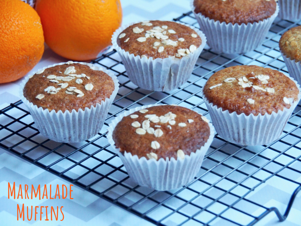 marmalade muffins with oranges in the background