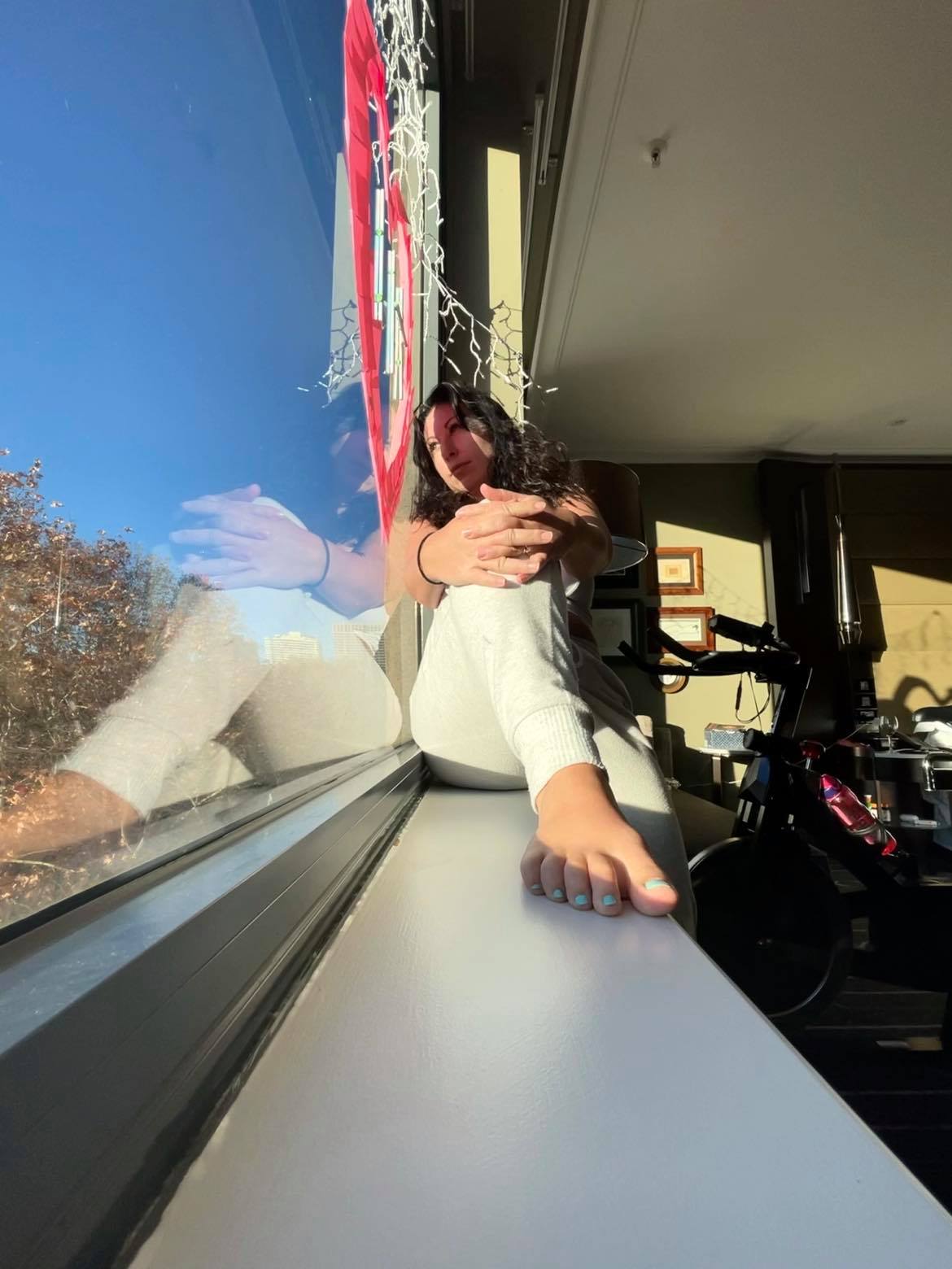 woman looking out hotel window