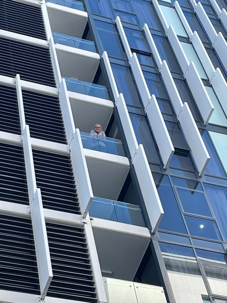 woman standing on balcony