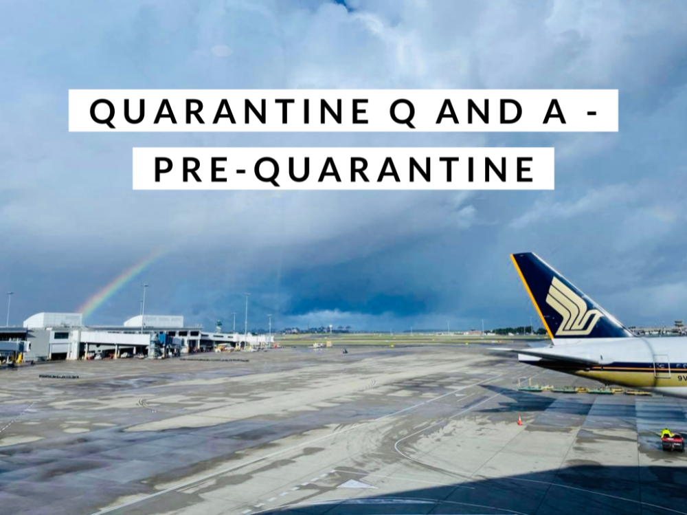 singapore airlines plane on runway with rainbow