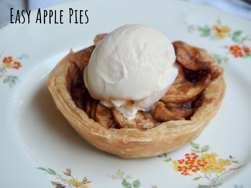 individual open topped apple pie with scoop of ice cream on top