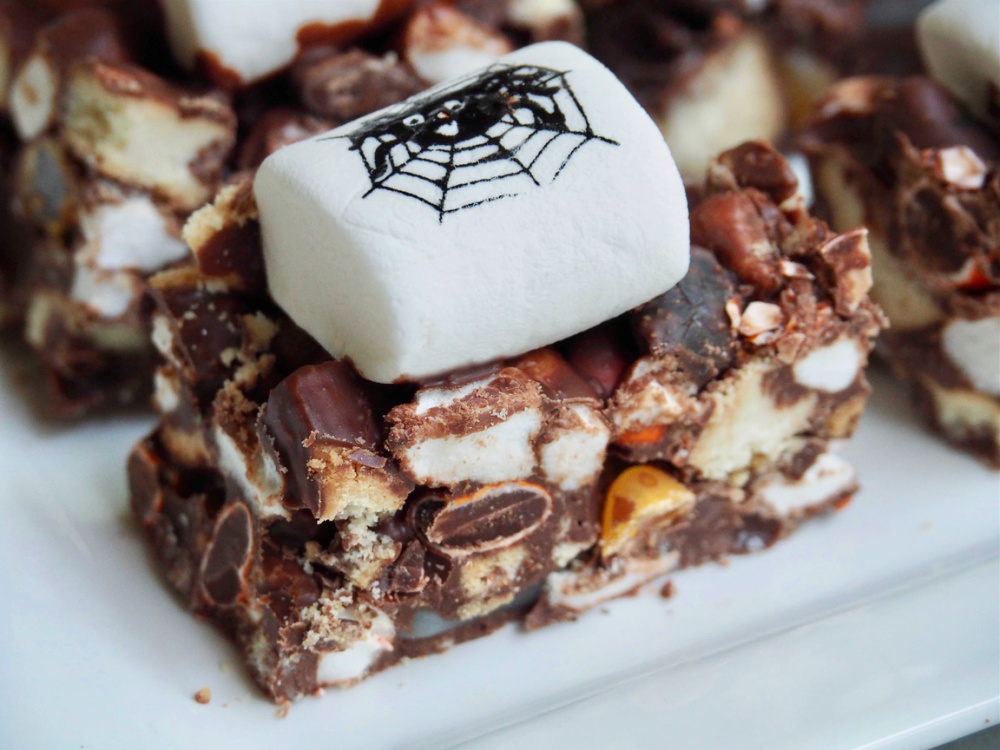 halloween rocky road topped with white marshmallow decorated with a spider