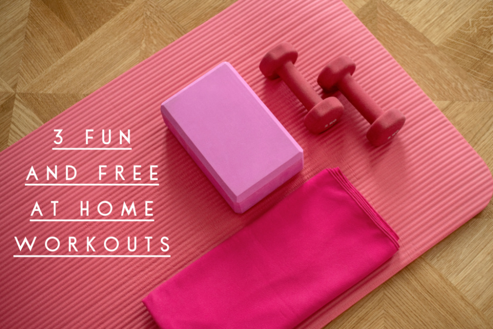 pink yoga brick hot pink towel and pair of pink dumbbells laying on pink yoga mat