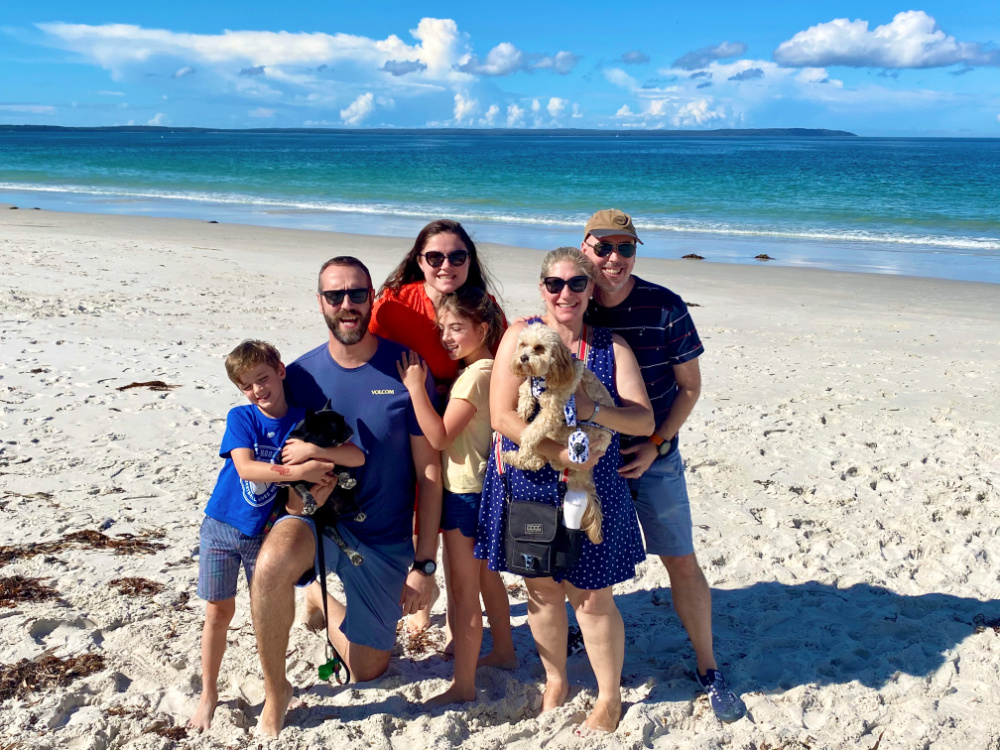 friends standing on a beach